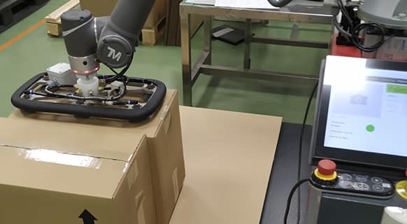 Paletizadora Cobot paleteando cajas